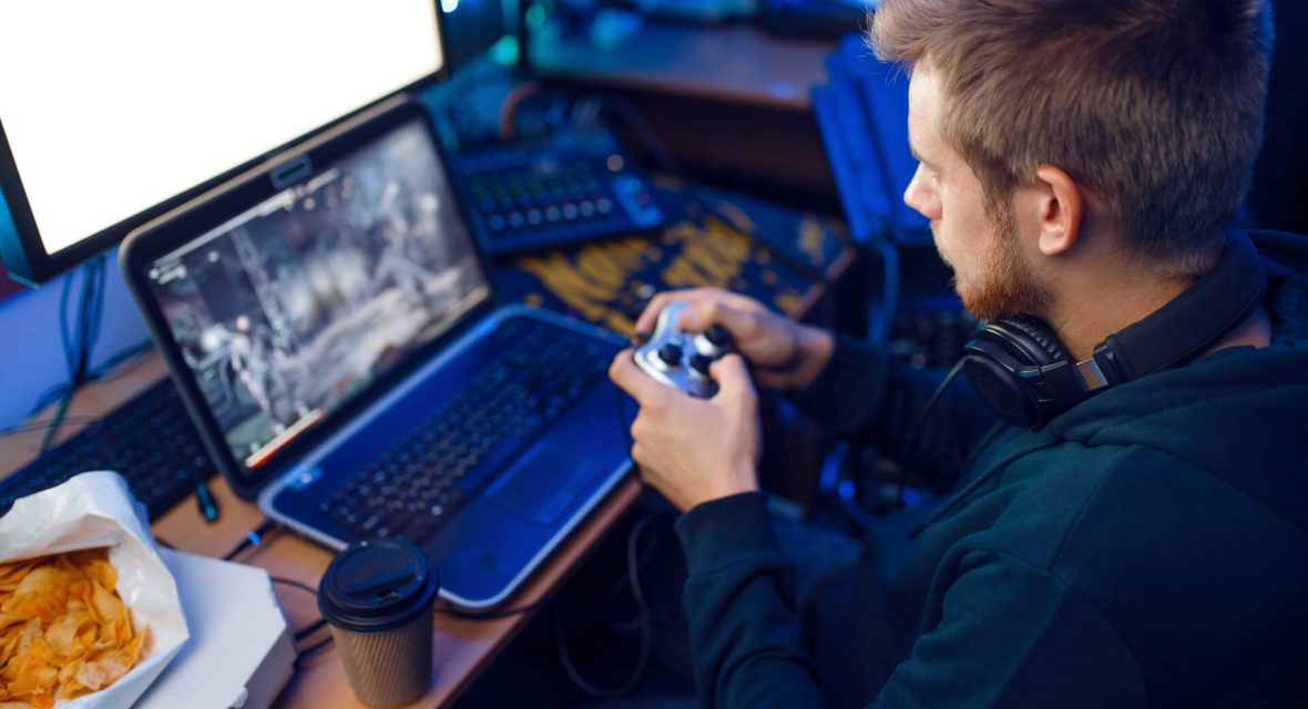 gamer-with-joystick-playing-videogame-on-console-2021-08-26-16-25-32-utc