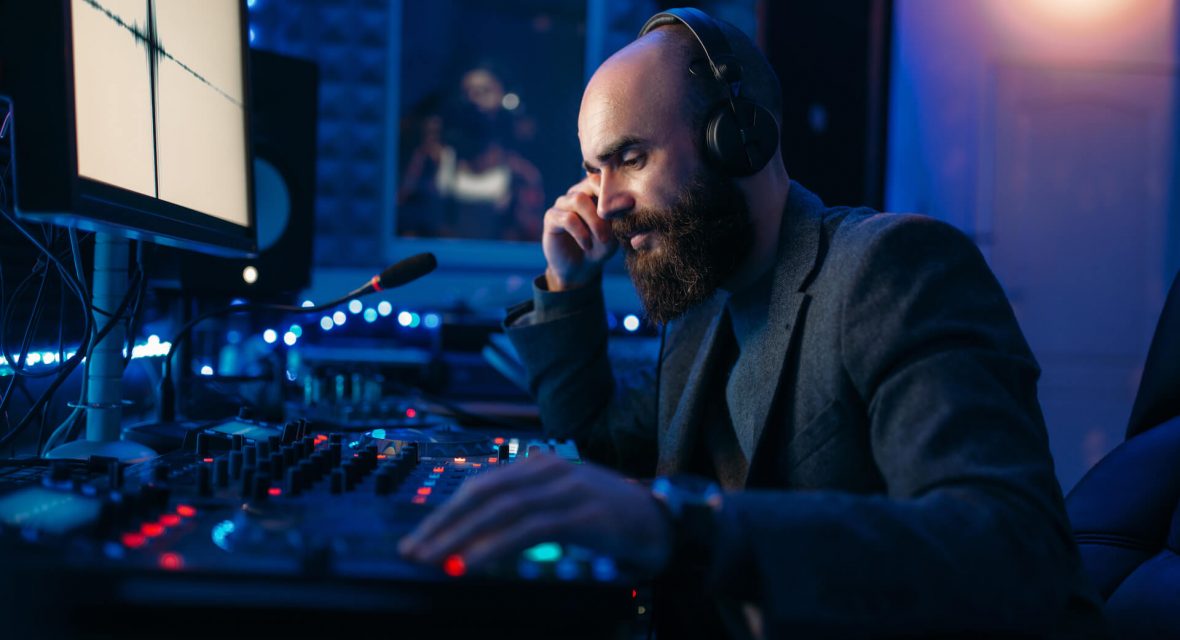 sound-engineer-in-headphones-listens-composition-2021-08-26-16-26-33-utc