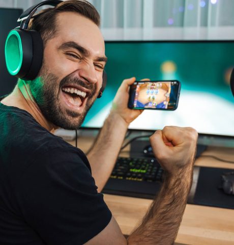 young-man-gamer-playing-video-games-on-smartphone-2021-12-09-07-39-42-utc